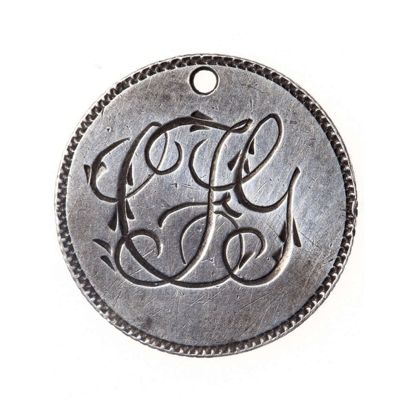 Love Token - "F.L.G." (?) on a Victorian .05 silver host coin
